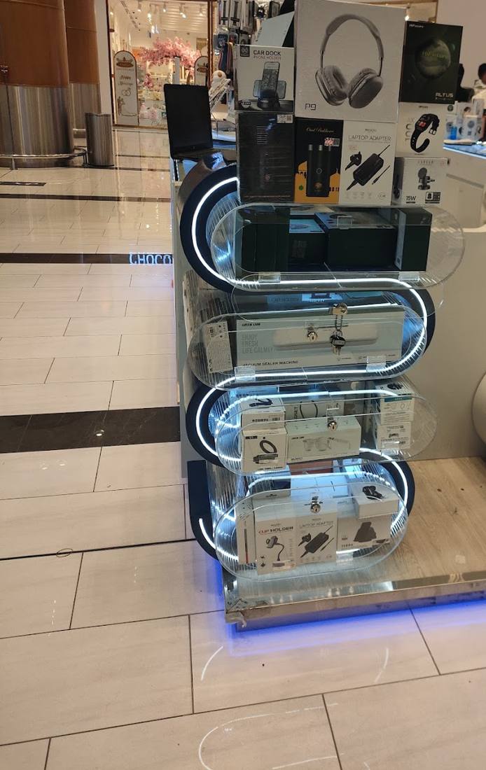 Over-ear headphones on the curved end display of the kiosk